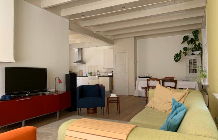 Open living room and kitchen in Holiday home in Corle, Winterswijk Corle, with modern furniture and homely atmosphere.