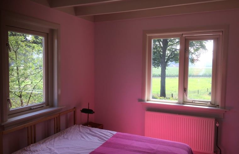 Bedroom in Holiday Home in Corle, Winterswijk Corle, overlooking green fields, ideal for rest and relaxation.