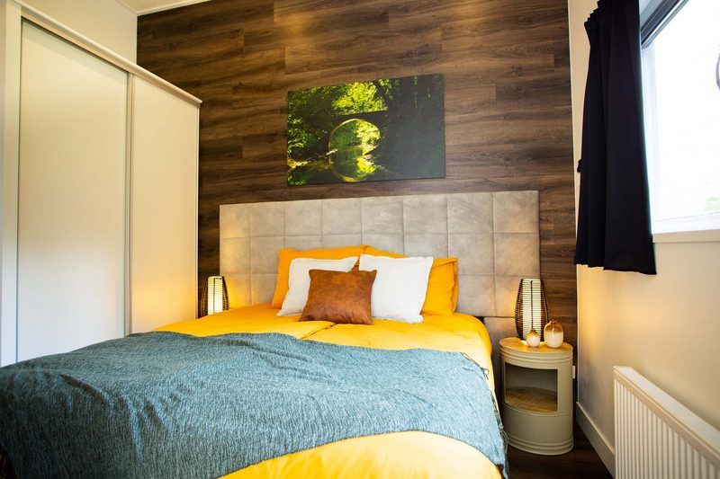 Bedroom in Beekhoeve 4 persons Wellness, Beekbergen, Veluwe, vacation home with comfortable furnishings.