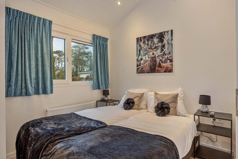 Bedroom with double bed in Ferox 5 persons Wellness vacation home in Ede, Veluwe.