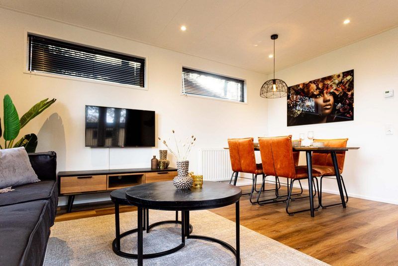 Dining area in Module Wood 4 persons vacation home in Ede, Veluwe with stylish dining table and decorative interior.