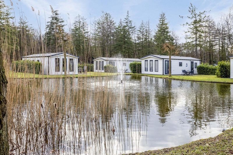 Holiday home 4 persons in Ede, Veluwe, Gelderland with views of pond and surrounding nature.