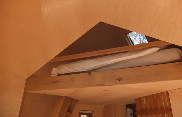 Gemuetliches Schlafzimmer im Ferienhaus Ede, Veluwe, mit Holzdetails.