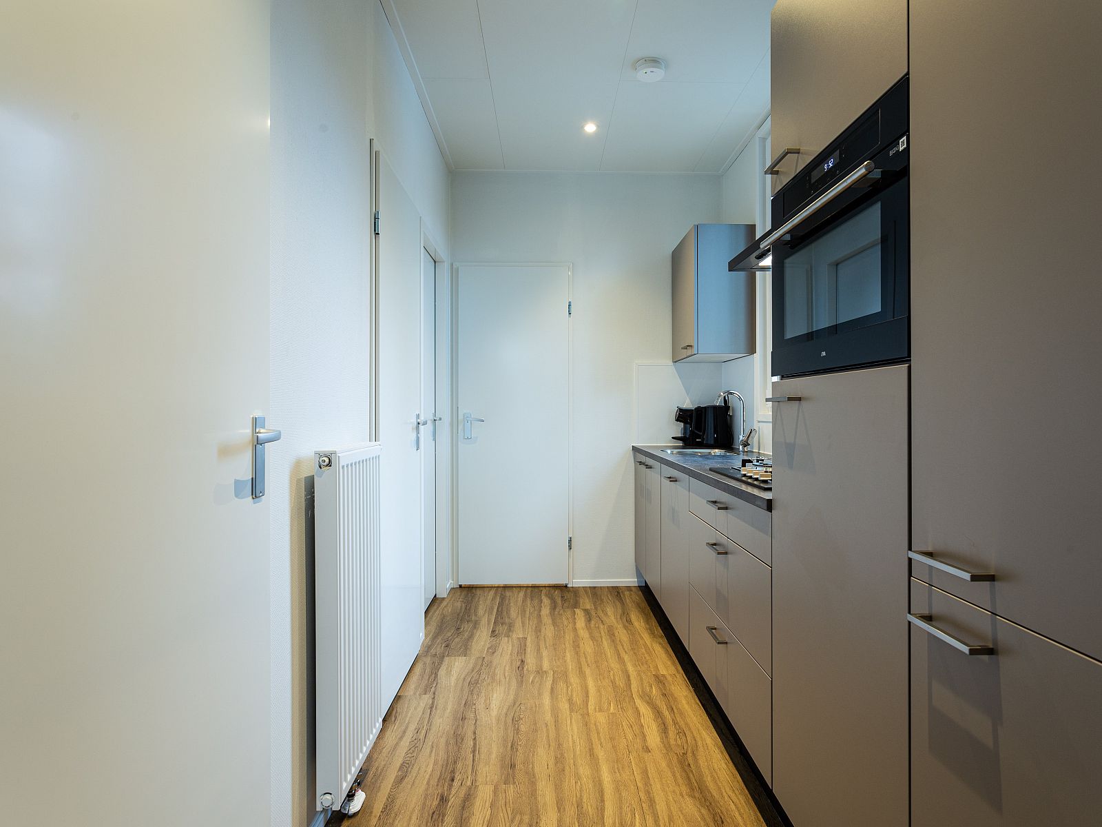 Modern kitchen of Module Limited Edition, a vacation home located in Ede, Veluwe, Gelderland.