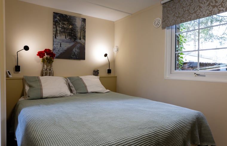 Bedroom in Holiday Home in Emst, Veluwe, with soothing decoration.