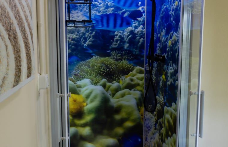 Bathroom in Holiday Home in Emst, Gelderland, with colorful shower wall.