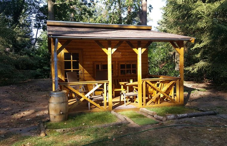 Porch of wooden cottage at Holiday home in Emst, surrounded by nature.