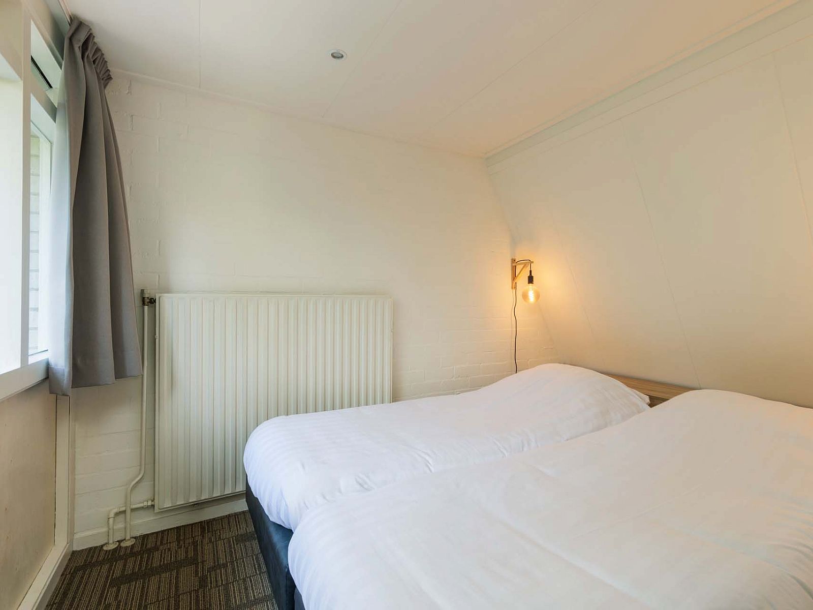 Bedroom with double bed in detached house Hoenderloo, Veluwe, Gelderland.