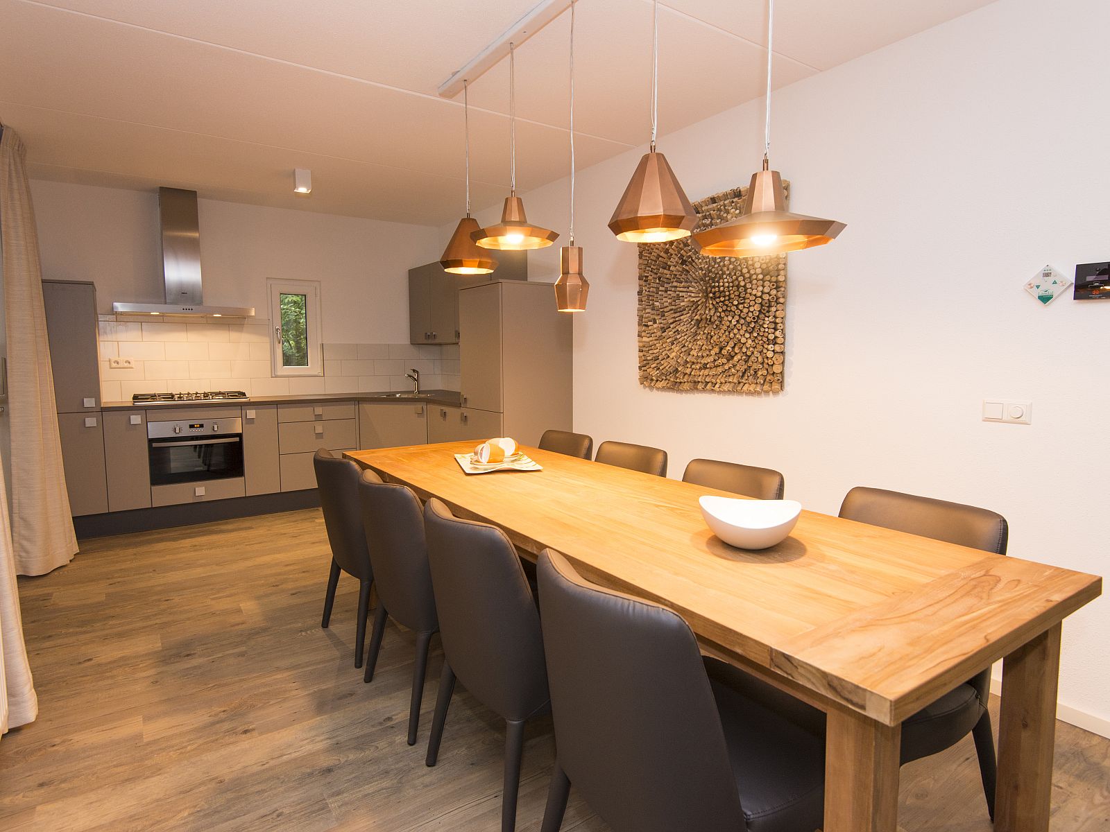 Modern living room with fireplace in Miggelenberg bungalow, Hoenderloo, Veluwe, Gelderland.