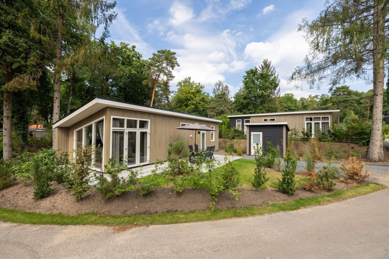 Detached house in Hoenderloo in the Veluwe, Gelderland, with modern exterior and green surroundings.