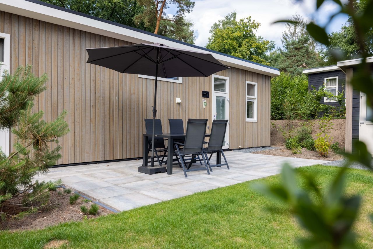 Terrace of detached house in Hoenderloo, Veluwe, with comfortable seating.
