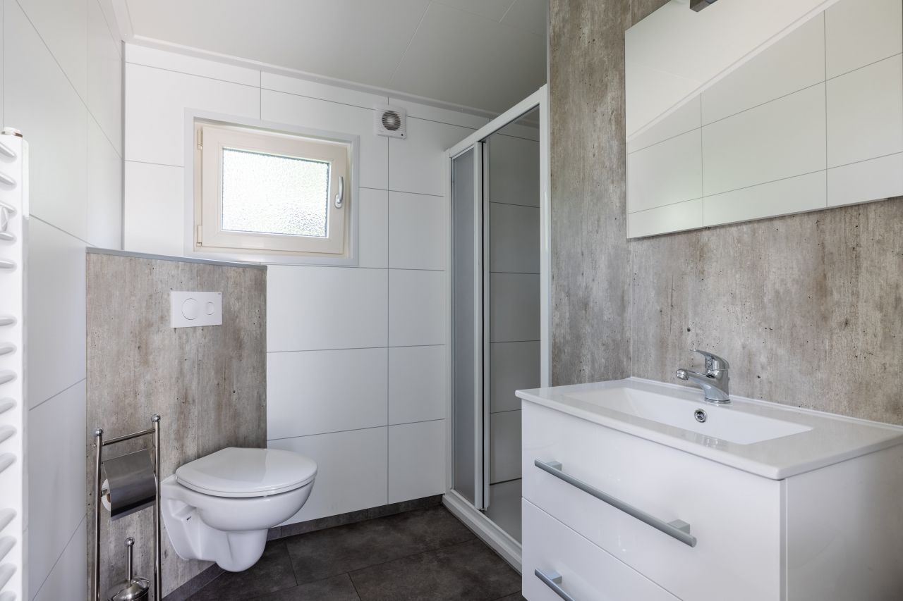 Modern bathroom in vacation home in Hoenderloo, Veluwe, with shower and elegant design.