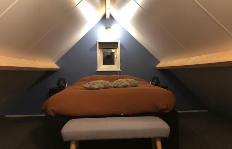 Cozy bedroom with double bed in Holiday home in 't Harde, Veluwe, Gelderland.