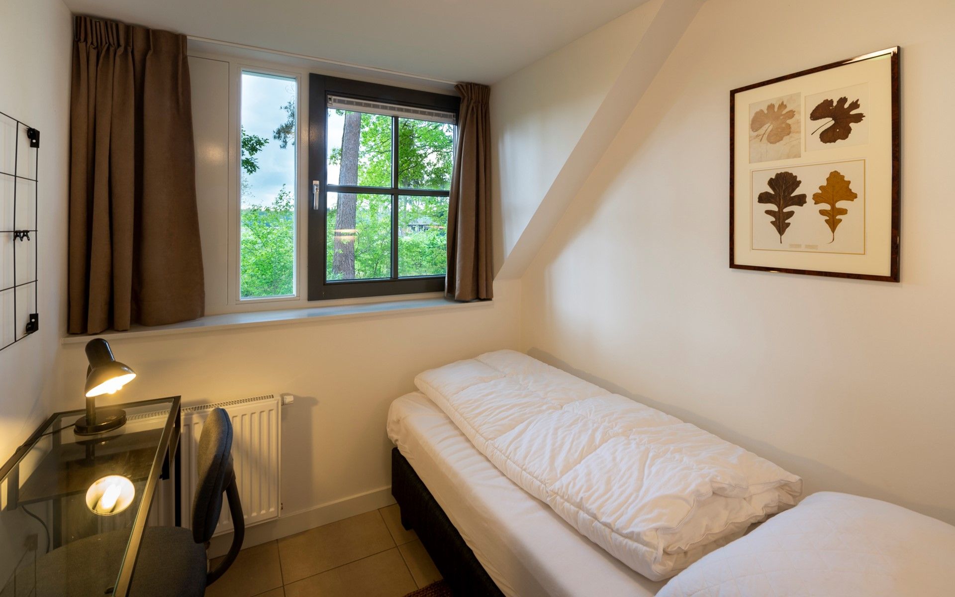 Bedroom with view in Holiday home Sprielderbosch 12 'De Kuifmees', vacation home in the Veluwe, Putten.