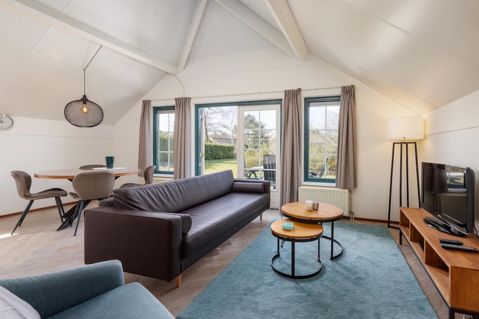 Cozy living room of Veluwse Hoevewoning 4 in Putten, Veluwe. Comfortable vacation home overlooking the green surroundings of Gelderland.