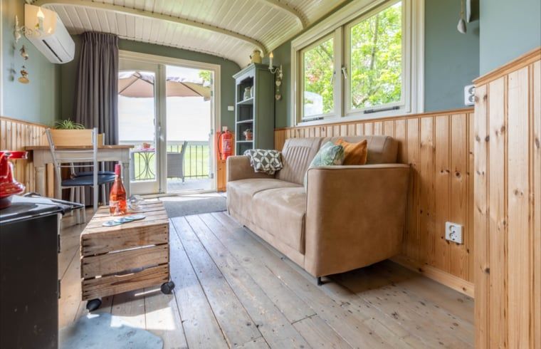 Cozy living room in Holiday Home in Wezep/Oldebroek, overlooking the Veluwe nature.
