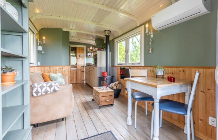 Dining and sitting area in Holiday Home in Wezep/Oldebroek, ideal for a relaxing Veluwe vacation.