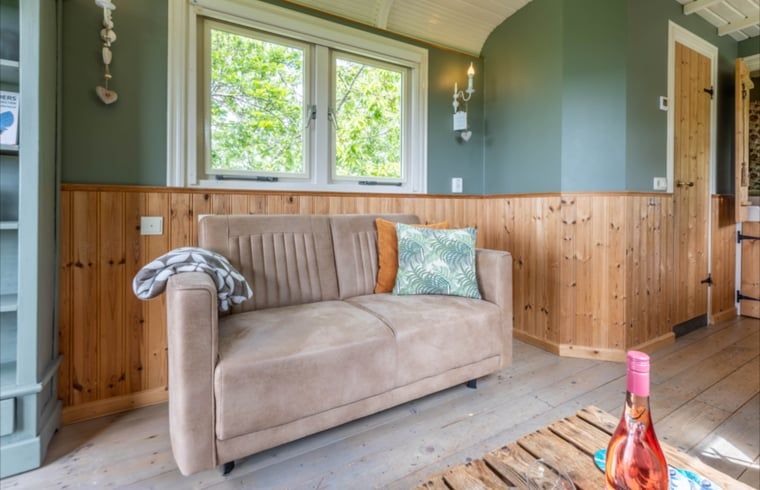 Comfortable sofa in the interior of Holiday Home in Wezep/Oldebroek, Veluwe, Gelderland.