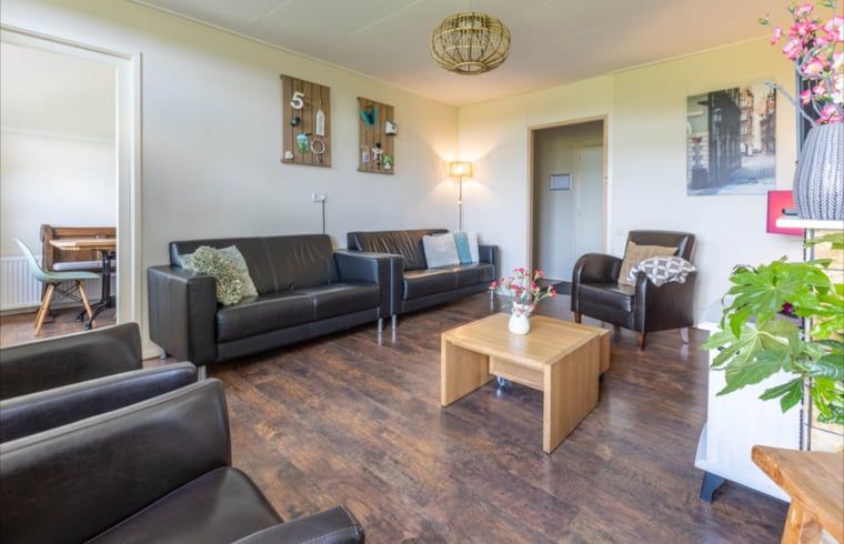 Cozy living room of Holiday home in Wezep Oldebroek, Veluwe, Gelderland with comfortable seating area.