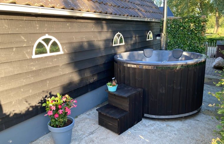 Private hot tub at Holiday home in Wezep Oldebroek, Veluwe, Gelderland for ultimate relaxation.