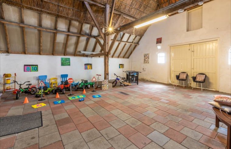 Play area for children in Holiday home in Wezep Oldebroek, Veluwe, Gelderland with toys.