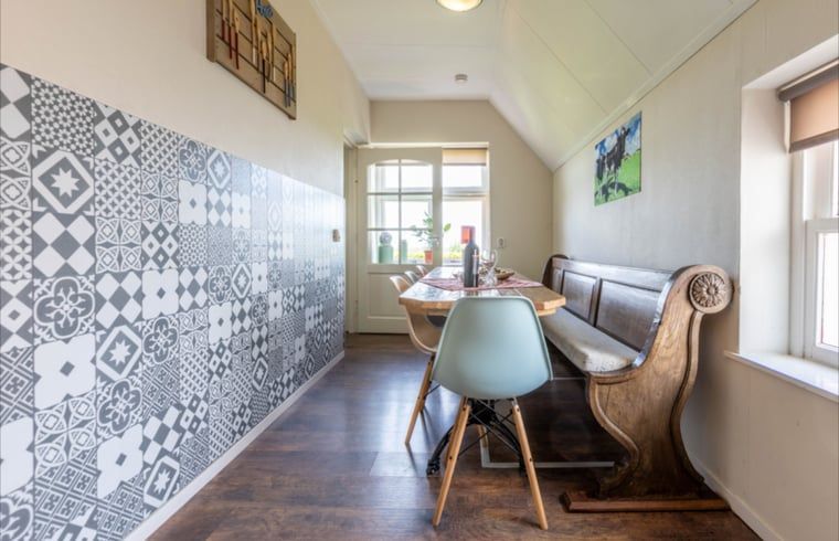 Dining area with wooden bench in Holiday home in Wezep Oldebroek, Veluwe, Gelderland.