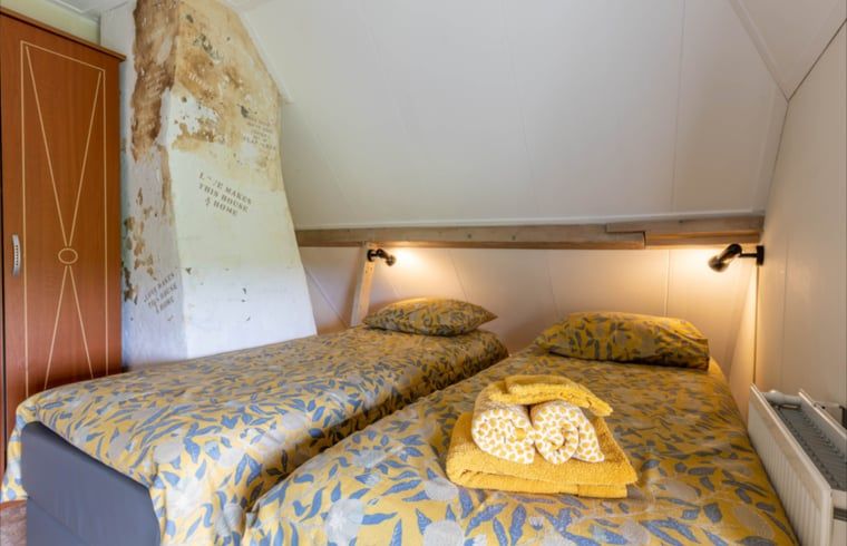 Bedroom with two beds in Holiday home in Wezep Oldebroek, Veluwe, Gelderland.