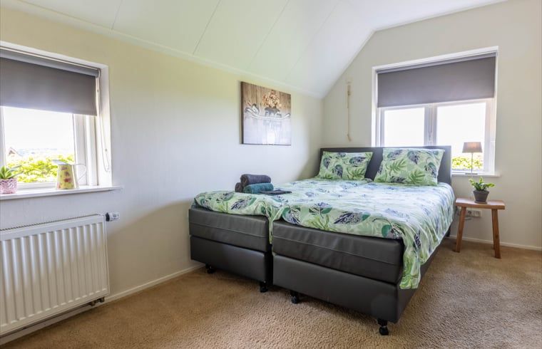 Spacious bedroom with double bed in Holiday home in Wezep Oldebroek, Veluwe, Gelderland.