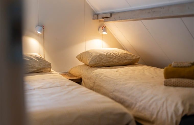 Cozy bedroom with two beds in Holiday cottage in Wezep Oldebroek, Veluwe, Gelderland.