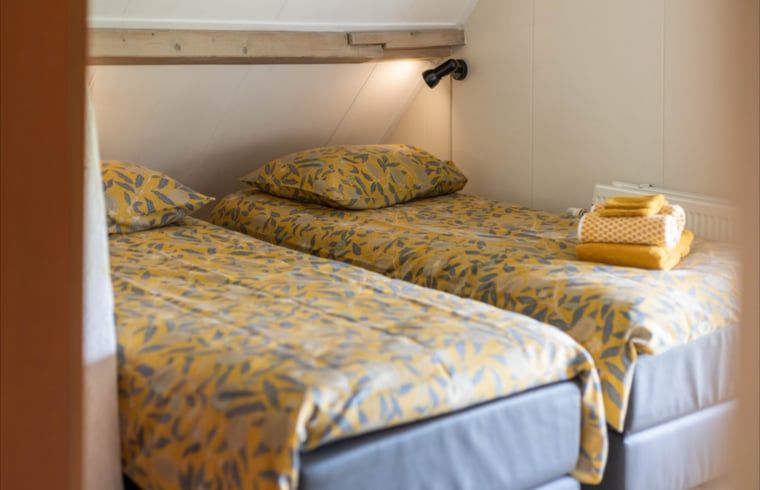 Bedroom with comfortable beds in Holiday cottage in Wezep Oldebroek, Veluwe, Gelderland.