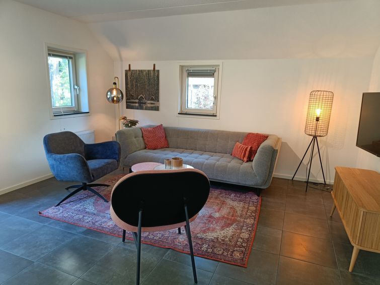 Gezellige zithoek in Vakantiehuis Geheim van Otterlo 6 in Otterlo, Veluwe, Gelderland voor ontspanning.