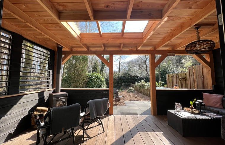 Enjoy the covered porch of Holiday Home in Epe, Veluwe, overlooking the natural surroundings of Gelderland.