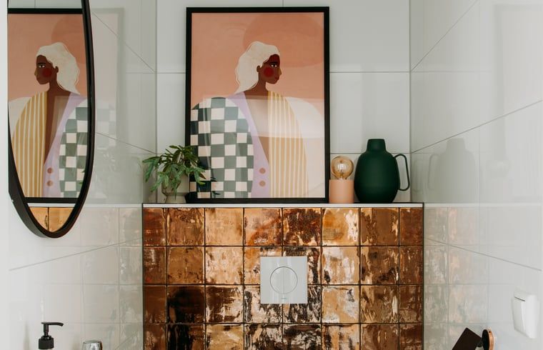Modern bathroom in Holiday Home in Nunspeet, Veluwe, with stylish tile wall and artistic details.