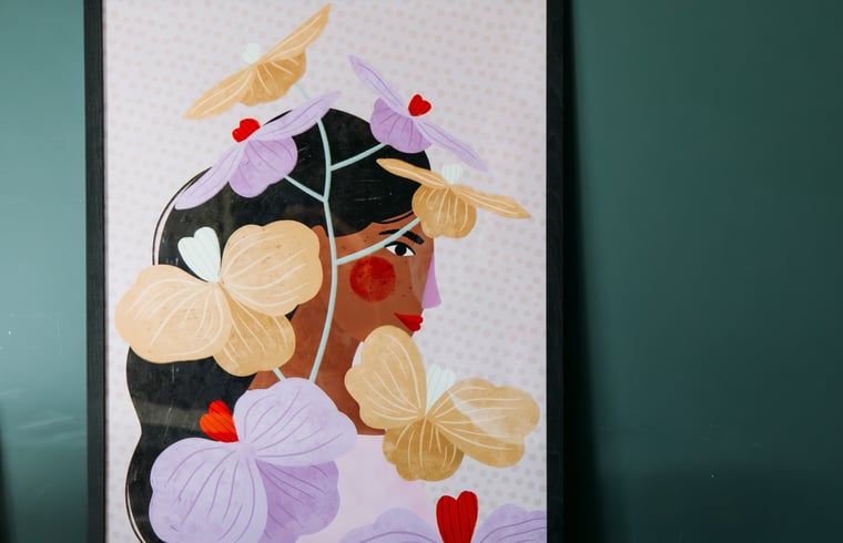 Artwork in Holiday cottage in Nunspeet, Veluwe, with colorful flowers and a female figure.