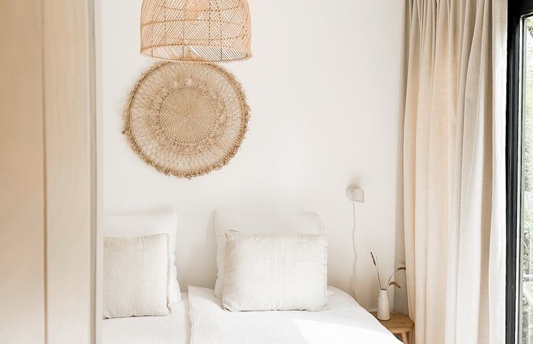 Attractive bedroom in Cottage in Nunspeet, Veluwe, Gelderland with natural decorations and soft bedding.