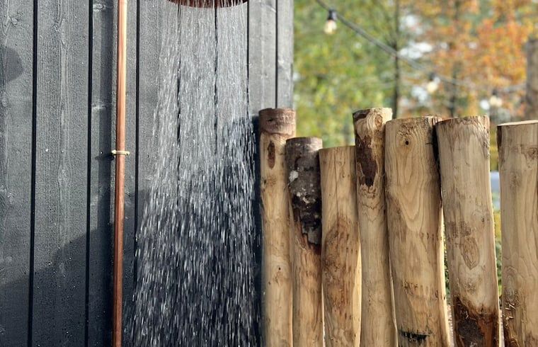 Refreshing outdoor shower at cottage in Nunspeet, Veluwe, Gelderland, ideal for a summer refresher.