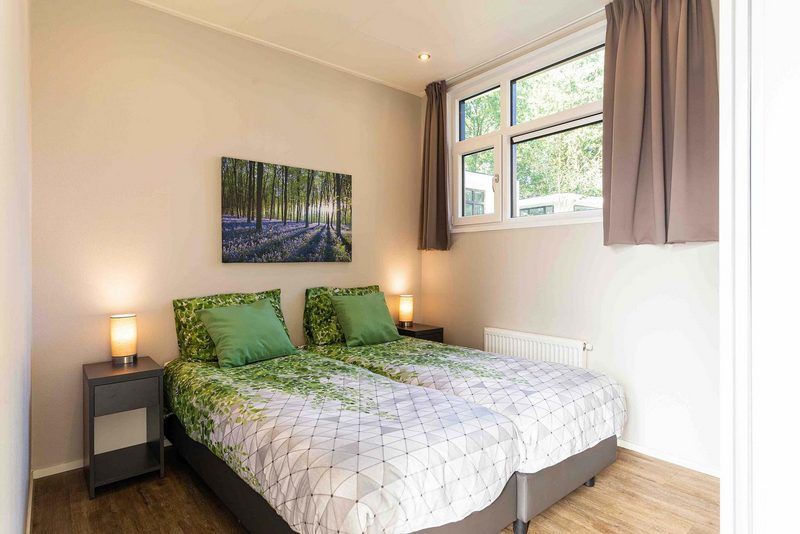 Cozy bedroom in Module special 4 persons vacation home, Lunteren, Veluwe with natural light.