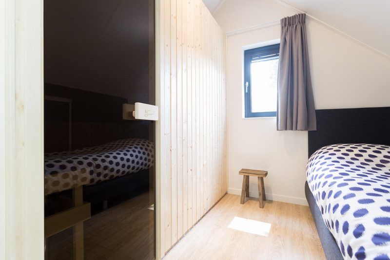 Schlafzimmer mit Sauna in Recreation Villa fuer 7 Personen, Lunteren, Veluwe fuer ultimative Entspannung.