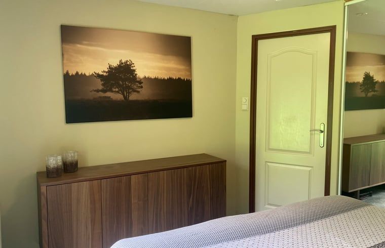 Interior of Cottage in Lunteren, Veluwe, with rustic wooden furniture.