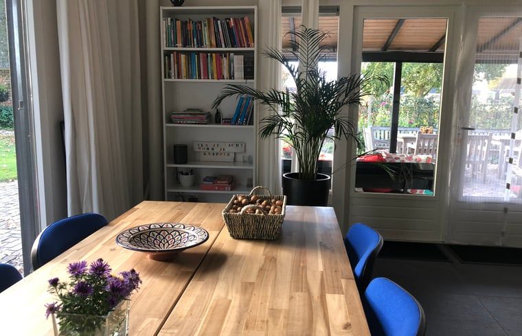 Cozy interior of Cottage in Wapenveld, Veluwe, Gelderland. Vacation home with stylish decor and views of the green garden.