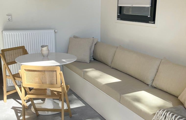 Dining area and sofa in Holiday home in Lieren, Veluwe, Gelderland.