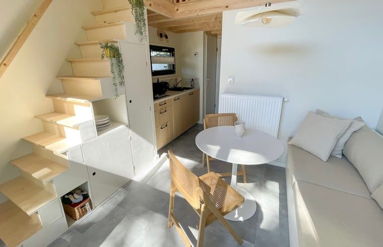 Open living space Cottage in Lieren with stairs to upper floor.