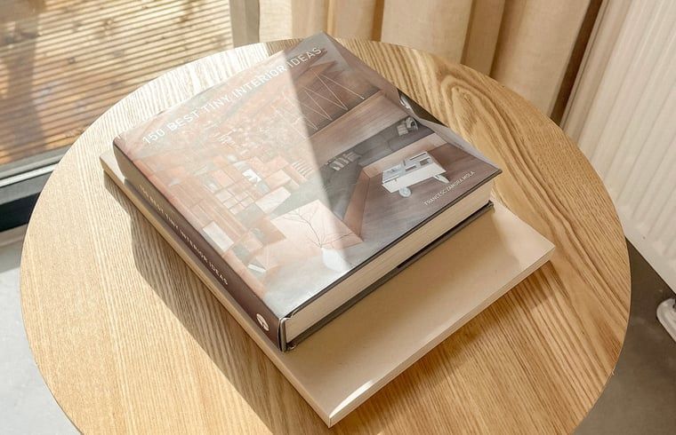 Interior book on the table at Holiday Home in Lieren, Veluwe.