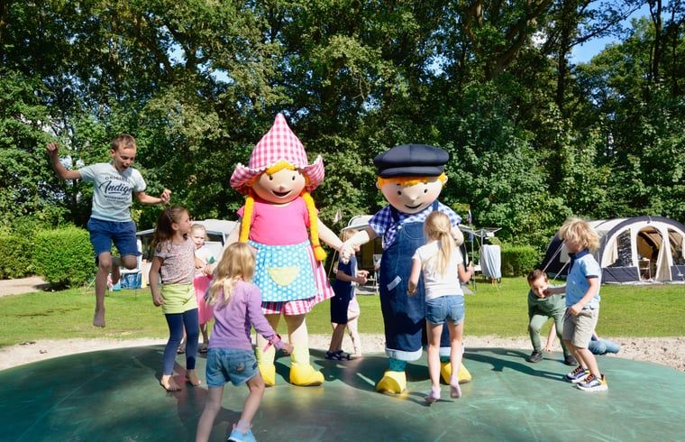 Children play with mascots at Cottage in Lieren, Veluwe, Gelderland.