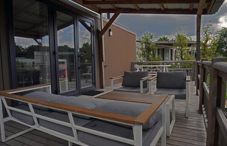 Cozy porch of Cottage in Lieren, vacation home in Lieren, Veluwe. Perfect for relaxing in the nature of Gelderland.