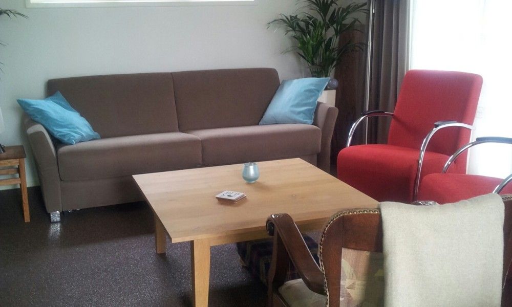 Gemuetliche Sitzecke im Ferienhaus mit Sauna in Vierhuizen, Groningen.