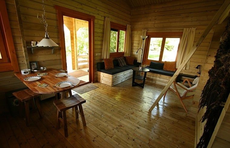 Dining and sitting area in Holiday cottage in Zoutkamp, perfect for family gatherings in Groningen.