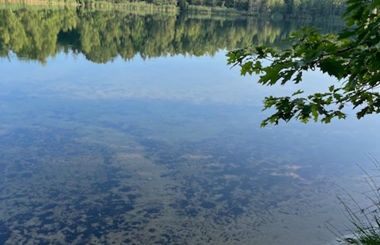 Clear water from a nearby lake at Cottage in Onstwedde, vacation home in Groningen.