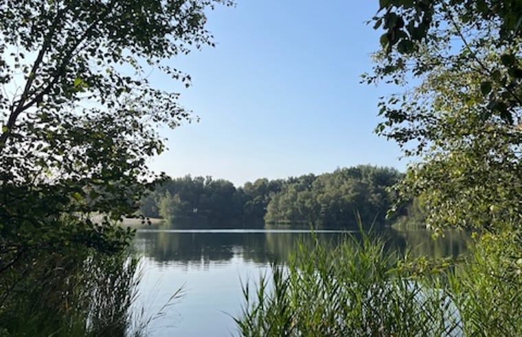 Gorgeous lake surrounded by greenery near Cottage in Onstwedde, vacation home in Groningen.