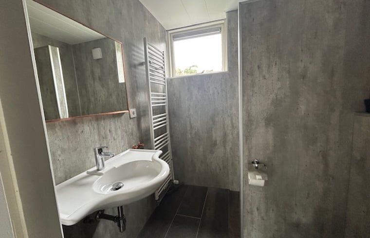 Modern bathroom in Holiday Home in Stramproy, Central Limburg. Comfortable stay with stylish interior and natural light.